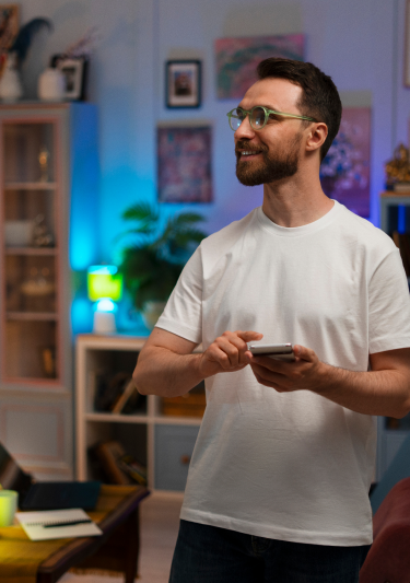 Man controlling smart switch with his mobile